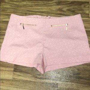 pink shorts with gold detail